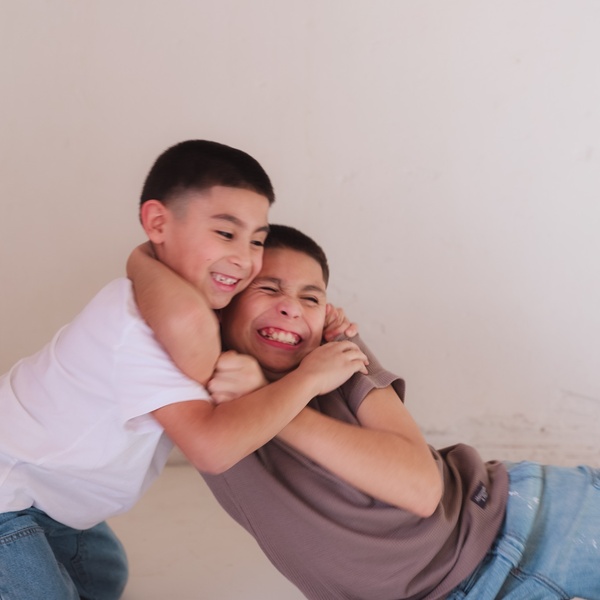 Mariah Hipolito’s two sons laughing and playing together